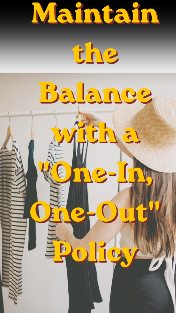 Women's fashion Pinterest pin from the file "Maintain the Balance with a One-In, One-Out Policy.jpg". A woman wearing a straw hat is seen from behind, browsing through a clothing rack with striped dresses and a black dress. Large yellow text overlays the image, reading "Maintain the Balance with a 'One-In, One-Out' Policy." The pin offers practical advice for women on decluttering and keeping a balanced, minimalist Capsule Wardrobe.